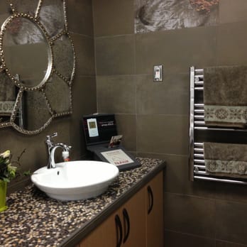 Atlanta Flooring Centre - a bathroom with a sink and mirror - Flooring Near Me - Mission, British Columbia