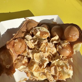Double Bubble Cafe - Bubble waffle with banana, Frosted Flakes and caramel. - Coffee & Tea Near Me - Maywood, New Jersey