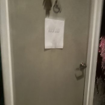 Greenhouse Kitchen + Bar - a bathroom door with a sign on it - Cocktail Bars Near Me - Vienna, Virginia