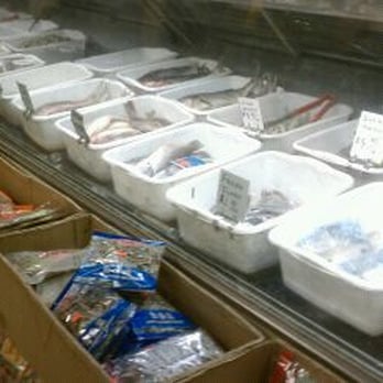 Evergreen Supply - a display case filled with plastic containers - International Grocery Near Me - Southfield, Michigan