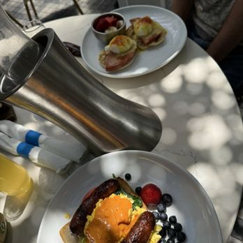 Blueberry’s Grill - Chicken sausage and harissa hummus toast, eggs Benedict, mimosa pitcher - Breakfast & Brunch Near Me - Wilmington, North Carolina