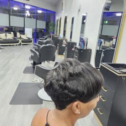 A chic, low‑maintenance pixie cut tailored to your face shape and hair texture. This style features precise detailing, soft or edgy shaping,