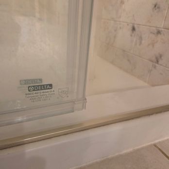 Showcase Remodels - This picture shows the gap created by leveling the shower doors. Now there is nothing preventing water from coming out. - General Contractors Near Me - Turnersville, New Jersey Showcase Remodels - This picture shows the gap created by leveling the shower doors. Now there is nothing preventing water from coming out. - General Contractors Near Me - Turnersville, New Jersey