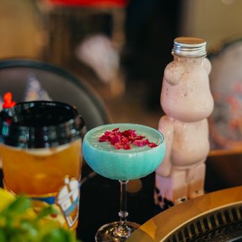 So Hot Hotpot - a blue cocktail with a garnish garnish - Hot Pot Near Me - Cary, North Carolina So Hot Hotpot - a blue cocktail with a garnish garnish - Hot Pot Near Me - Cary, North Carolina
