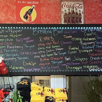 Sena's Beef Jerky - a menu on the wall - A black illuminated menu board displays a variety of jerky flavors, including spicy, sweet, and savory options, at Sena's Beef Jerky in Albuquerque, NM. - Specialty Food Near Me - Albuquerque, New Mexico