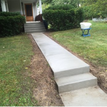 Cuco Concrete Repair - a concrete walkway in front of a house - Masonry/Concrete Near Me Cuco Concrete Repair - a concrete walkway in front of a house - Masonry/Concrete Near Me