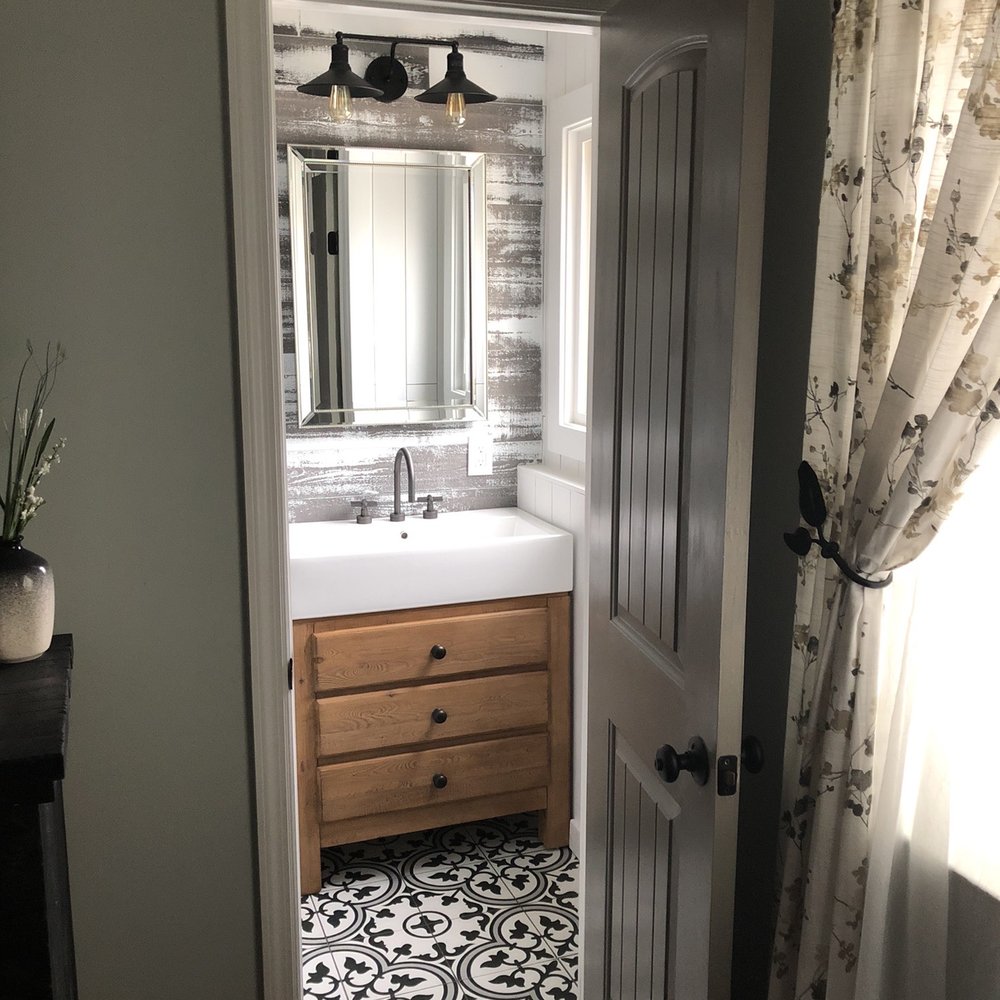 Renovate Right - a bathroom with a sink and a mirror - General Contractors Near Me - Copiague, New York Renovate Right - a bathroom with a sink and a mirror - General Contractors Near Me - Copiague, New York