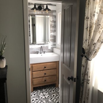 Renovate Right - a bathroom with a sink and a mirror - General Contractors Near Me - Copiague, New York Renovate Right - a bathroom with a sink and a mirror - General Contractors Near Me - Copiague, New York