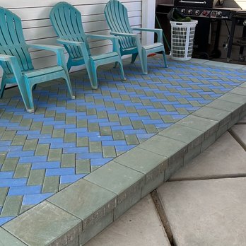 Richmoon Home Improvement - a patio with blue chairs - General Contractors Near Me Richmoon Home Improvement - a patio with blue chairs - General Contractors Near Me