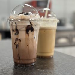 SDK’s Cafe and Coffee - (forefront) chocolate milk (background, partially drank) dolce de leche with light whip
