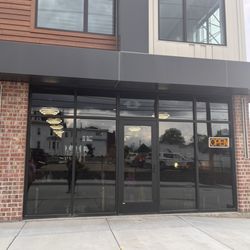 Piercings On Main - The front of the shop with open sign!