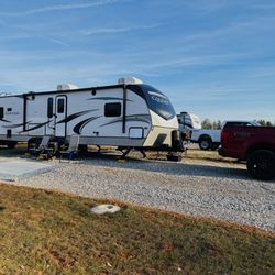 River Pointe RV Park & Campground - Example of long pull through lot - middle rows are pull through - we can easily fit our 34 foot trailer and both of our vehicles on our lot.
