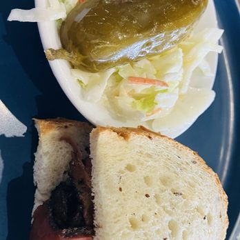 Zinger's Delicatessen - Half pastrami sandwich with pickle and coleslaw - Delis Near Me - Boca Raton, Florida Zinger's Delicatessen - Half pastrami sandwich with pickle and coleslaw - Delis Near Me - Boca Raton, Florida