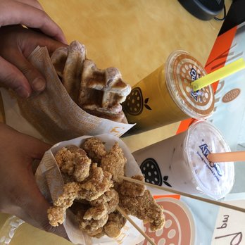 Quickly - a person holding a plate of fried food - Bubble Tea Near Me - South San Francisco, California Quickly - a person holding a plate of fried food - Bubble Tea Near Me - South San Francisco, California