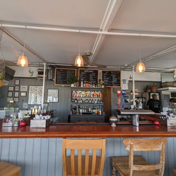 Hideaway - Montauk - a bar with wooden bar stools - Mexican Near Me - Montauk, New York