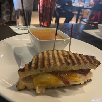 Baker's Crust - Tomato and cheddar soup paired with the chicken and cheddar panini - Breakfast & Brunch Near Me - Virginia Beach, Virginia Baker's Crust - Tomato and cheddar soup paired with the chicken and cheddar panini - Breakfast & Brunch Near Me - Virginia Beach, Virginia