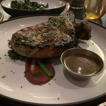 Harvest - Pork chop with fennel pollen, rosemary, garlic, orange, and broccoli rabe. - New American Near Me - Las Vegas, Nevada Harvest - Pork chop with fennel pollen, rosemary, garlic, orange, and broccoli rabe. - New American Near Me - Las Vegas, Nevada