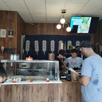 Tornado Crepes - a man ordering food at a restaurant - Creperies Near Me - New York, New York Tornado Crepes - a man ordering food at a restaurant - Creperies Near Me - New York, New York