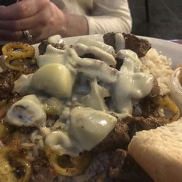 Cedars Dish. It's a lamb dinner over rice, but they fry up some of the mild peppers and a group of melty cheese, very very good
