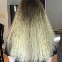 Tulu Salon and Spa - Morning after the appointment -- hair appearing dry, frizzy, and tangled following a normal wash.