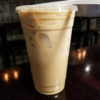 Cafecito - Cafe con leche...too bad it came in a disposable plastic cup - Cuban Near Me - Chicago, Illinois