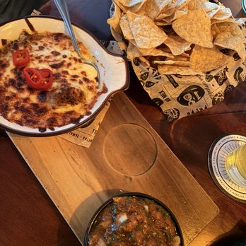 Momocho - Queso Fundido (left) and chile tomato salsa - Mexican Near Me - Cleveland, Ohio Momocho - Queso Fundido (left) and chile tomato salsa - Mexican Near Me - Cleveland, Ohio