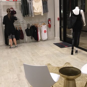 Pure Barre - Seating in front of the cubbies, and merchandise - Barre Classes Near Me - Pearland, Texas