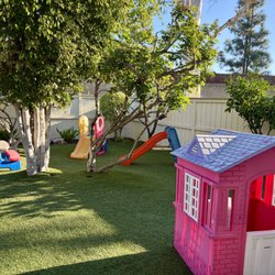 Little Angels Family Childcare - Backyard with enriching toys and plenty of play space!