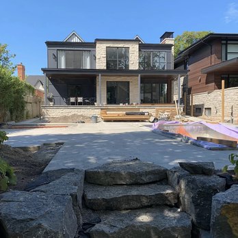 ZAE homes - a large backyard with a stone patio - General Contractors Near Me - Brampton, Ontario