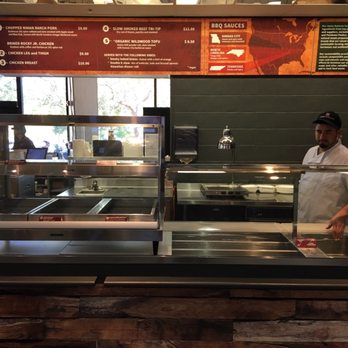 Barbecue 101 - a man preparing food in a restaurant - American Near Me - Stanford, California Barbecue 101 - a man preparing food in a restaurant - American Near Me - Stanford, California