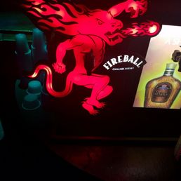 a lit up picture of a bottle of booze