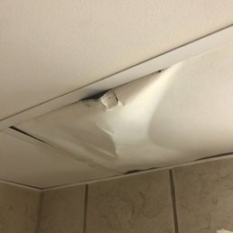Damaged ceiling tile so the leak would drain.