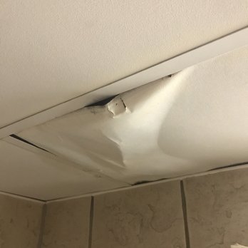 Plus Ramkota Hotel - Damaged ceiling tile so the leak would drain. - Hotels Near Me - Bismarck, North Dakota