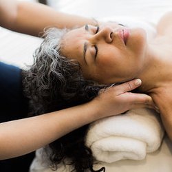 CN Massage Therapy - A woman receiving a relaxing neck massage