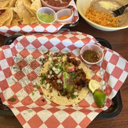 Al pastor, chips and salsa and side of rice & beans (no pictured is the steak taco I devoured)