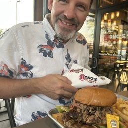Half pound burger with pulled pork and one side. Half pound burger with pulled pork and one side.