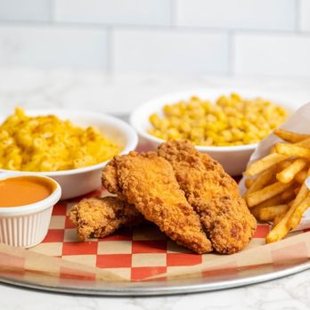 Chick'nCone - a plate of chicken nuggies, macaroni and cheese fries, and a side of macaroni - Chicken Shop Near Me - Estero, Florida
