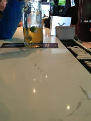 Photo of 33 Taps Hollywood - Los Angeles, CA, US. Marble tables at the bar