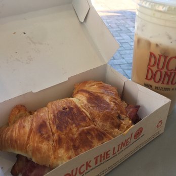 Duck Donuts - Sandwich: Bacon, Sausage, Egg, and Cheese Croissant  Drink: Hazelnut cold brew with sweet cream foam - Donuts Near Me - Rancho Cucamonga, California