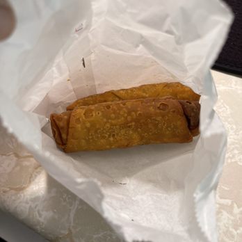 Great China Restaurant - a hand holding a piece of bread - Chinese Near Me - Albuquerque, New Mexico