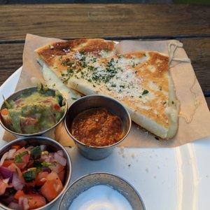 Photo of Lost & Found Beer Garden - Oakland, CA, United States. Cheese Quesadilla ($9) - 2.5 stars. Salsa wasn't fresh, cheese was hard, overall not great. Sun afternoon 2017-12-17