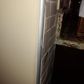 The Tile Guy - Not even inside metal border. - Tiling Near Me