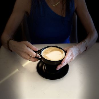 Yellow Brick Coffee - Latte (12 oz) with oat milk and lavender honey ($9!).  5/2025 - Coffee & Tea Near Me - Tucson, Arizona