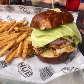 The Hub Mesa - Grilled chicken burger with garlic fries - Guns & Ammo Near Me - Mesa, Arizona