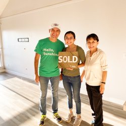 John Reeves Team at Reef Point Real Estate - Happy family after closing on a condo