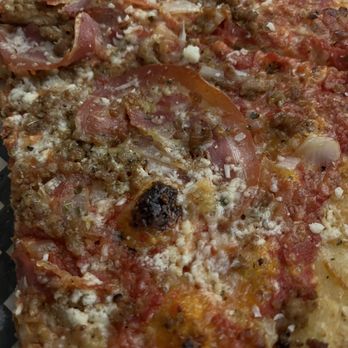 Pizzeria Guerrilla - a slice of pizza on a checkered plate - Pizza Near Me - Courtenay, British Columbia Pizzeria Guerrilla - a slice of pizza on a checkered plate - Pizza Near Me - Courtenay, British Columbia