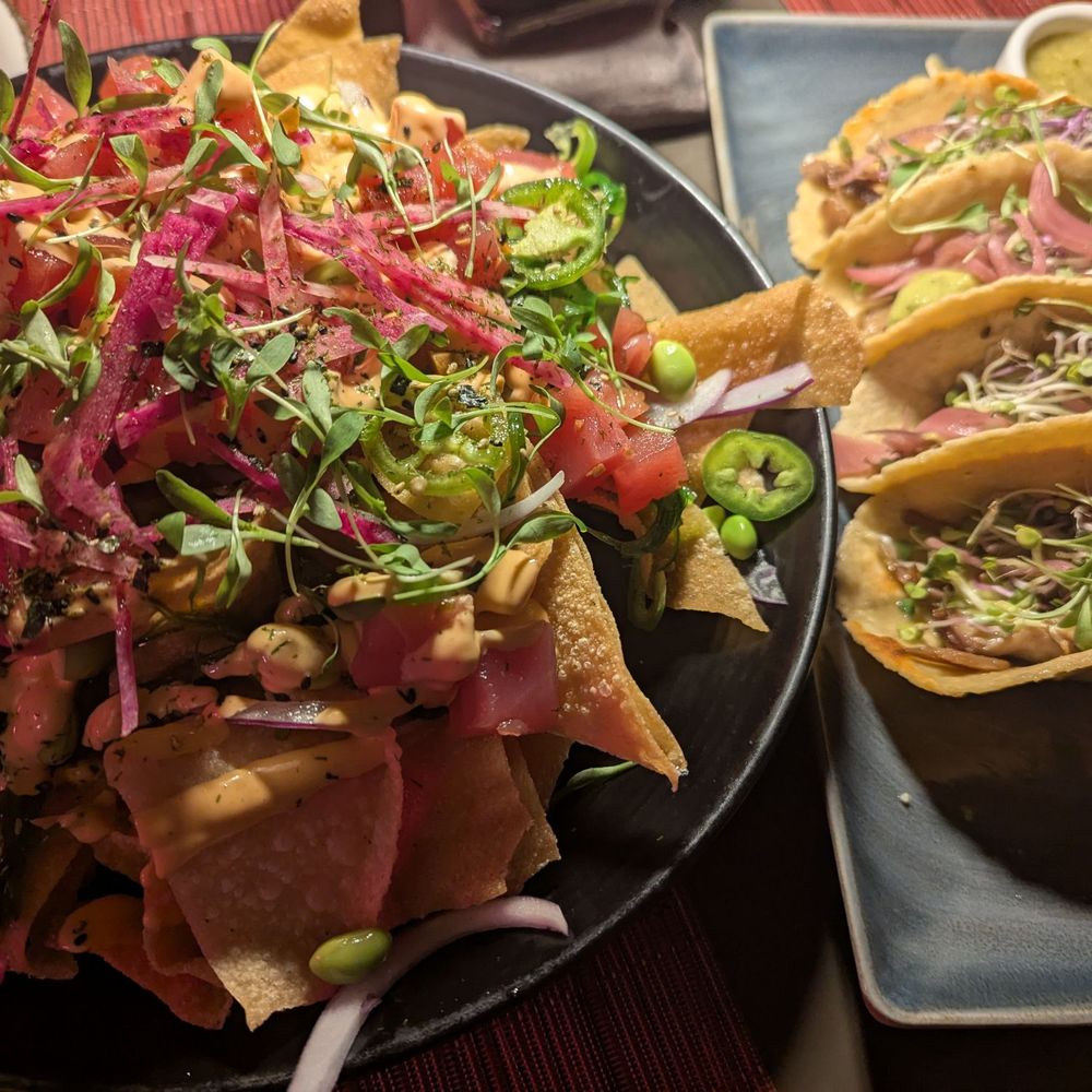 Ahi Poke Nachos (left) and Duck Carnitas Tacos (right)