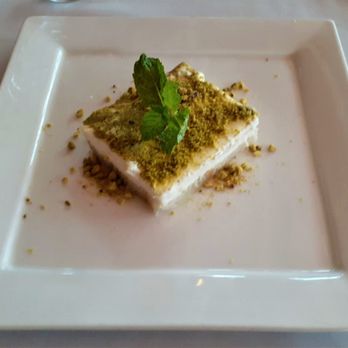 Cafe Santorini - Ashta cake infused with rose and topped with pistachios. Creamy heaven and so Mediterranean. - Italian Near Me - Pasadena, California Cafe Santorini - Ashta cake infused with rose and topped with pistachios. Creamy heaven and so Mediterranean. - Italian Near Me - Pasadena, California