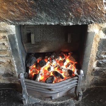 O'Sullivan's - Little fire in the main room. - Irish Near Me