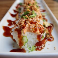 RAKKAN Ramen - DTLA - Kanikama Sushi Bites come topped with savory teriyaki sauce and crunchy fried onions!